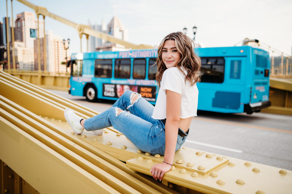Senior pictures in pittsburgh on the yellow bridge with blue bus behind

full senior portrait session